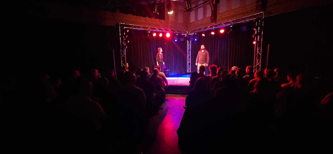 Photo graph of six people on stage